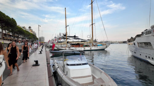 Video - La Condamine, Monaco - September 8, 2024: People walking near white boats docked in the Monaco Marina