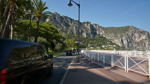 Video - Beaulieu-sur-Mer, France - July 5, 2024: Cars moving on the streets of the city in daylight
