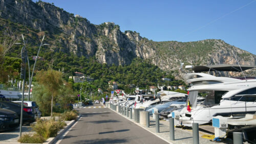 Video - Beaulieu-sur-Mer, France - July 5, 2024: Cars moving on the streets of the city near the port