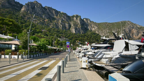 Video - Beaulieu-sur-Mer, France - July 5, 2024: Cars moving on the streets of the city near the port