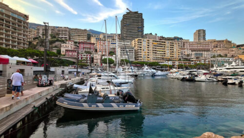 Video - La Condamine, Monaco - September 8, 2024: View of white boats docked in the Monaco Marina with the skyline of the city on the background