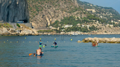 Video - Beaulieu-sur-Mer, France - July 5, 2024: People swimming and relaxing at the Petite Afrique Beach