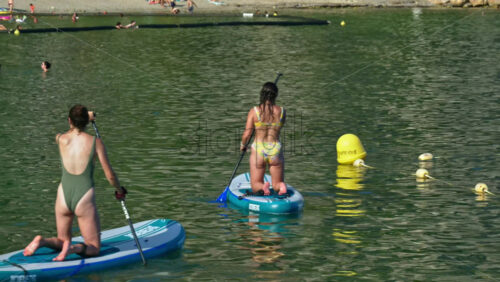 Video - Beaulieu-sur-Mer, France - July 5, 2024: People swimming and relaxing at the Petite Afrique Beach