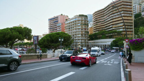 Video - Monaco city, Monaco - September 14, 2024: People and cars moving on the streets of the city