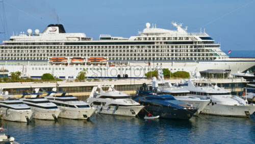 Video - La Condamine, Monaco - September 8, 2024: View of white yacht and multiple boats docked in the Monaco Marina