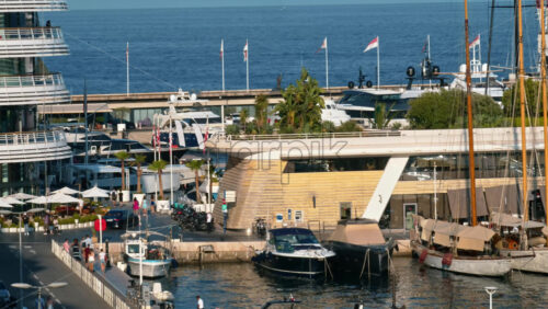Video - La Condamine, Monaco - September 8, 2024: View of boats docked in the Monaco Marina with people moving near it