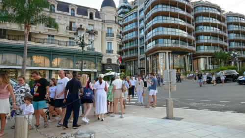 Video - Monte Carlo, Monaco - September 14, 2024: People crossing the street in front of the Monte Carlo Casino