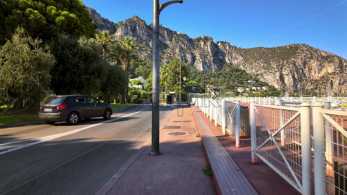 Video - Beaulieu-sur-Mer, France - July 5, 2024: Cars moving on the streets of the city in daylight