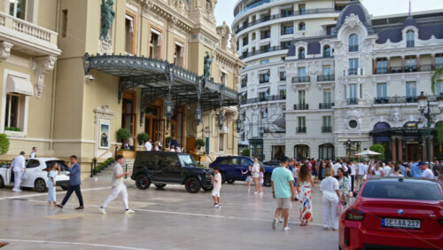 Video - Monte Carlo, Monaco - October 4, 2024: People walking through the courtyard of the Monte-Carlo Casino