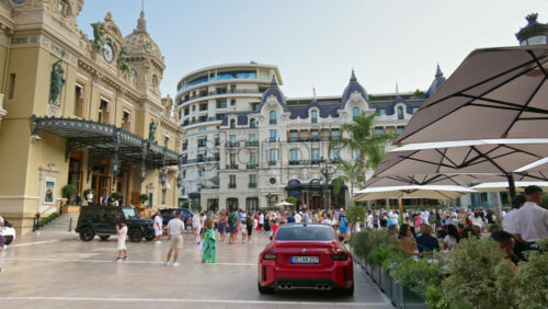 Video - Monte Carlo, Monaco - October 4, 2024: People walking through the courtyard of the Monte-Carlo Casino