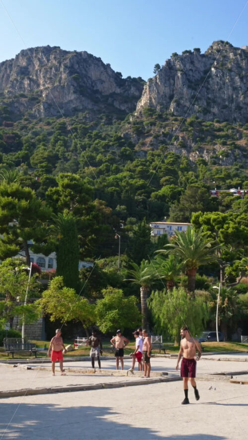 Video - Beaulieu-sur-Mer, France - July 5, 2024: Men playing on the Petite Afrique Beach. Vertical
