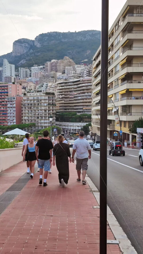 Video - Monaco city, Monaco - September 14, 2024: People and cars moving on the streets of the city. Vertical