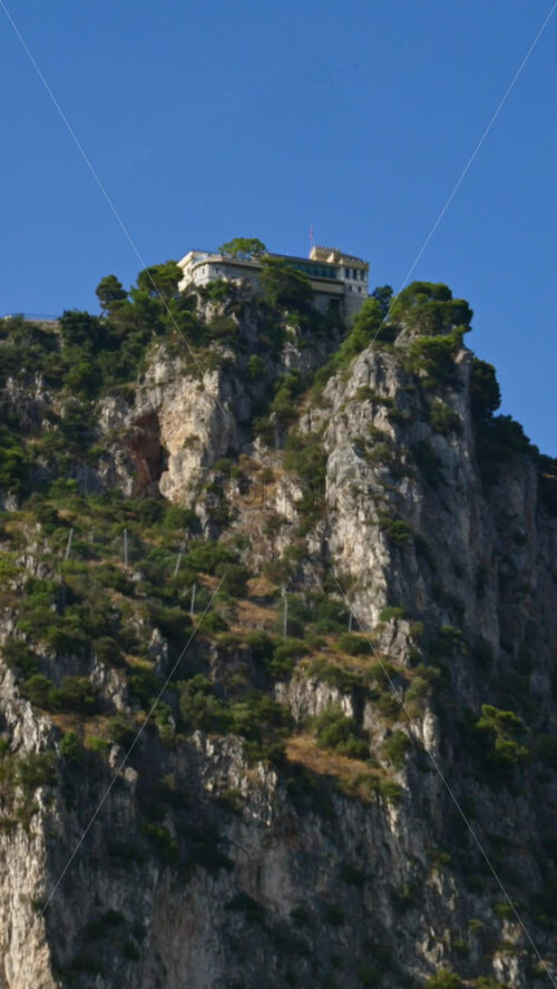 Video - Beaulieu-sur-Mer, France - July 5, 2024: People swimming and relaxing at the Petite Afrique Beach. Vertical