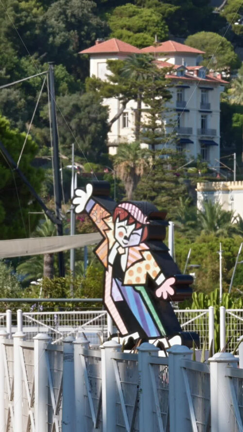 Video - Beaulieu-sur-Mer, France - July 5, 2024: Dancing Boy by Romero Britto figurine near a port. Vertical