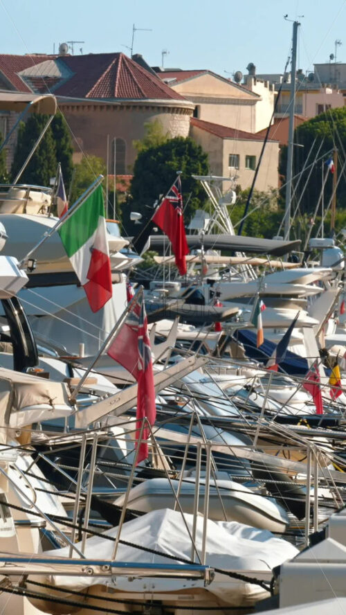 Video - Beaulieu-sur-Mer, France - July 5, 2024: White boats docked in the Port of Beaulieu-sur-Mer in daylight. Vertical
