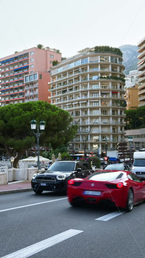Video - Monaco city, Monaco - September 14, 2024: People and cars moving on the streets of the city. Vertical