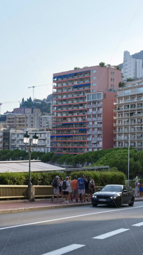 Video - Monaco city, Monaco - September 14, 2024: People and cars moving on the streets of the city. Vertical