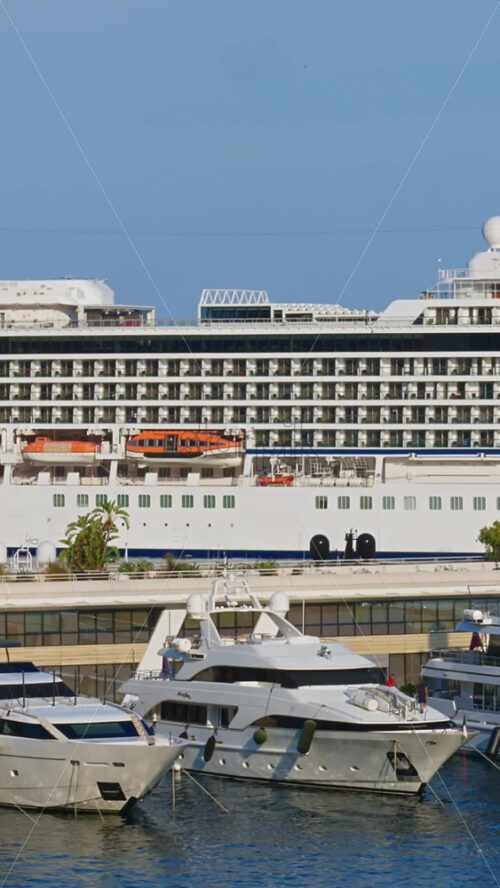 Video - La Condamine, Monaco - September 8, 2024: View of white yacht and multiple boats docked in the Monaco Marina. Vertical