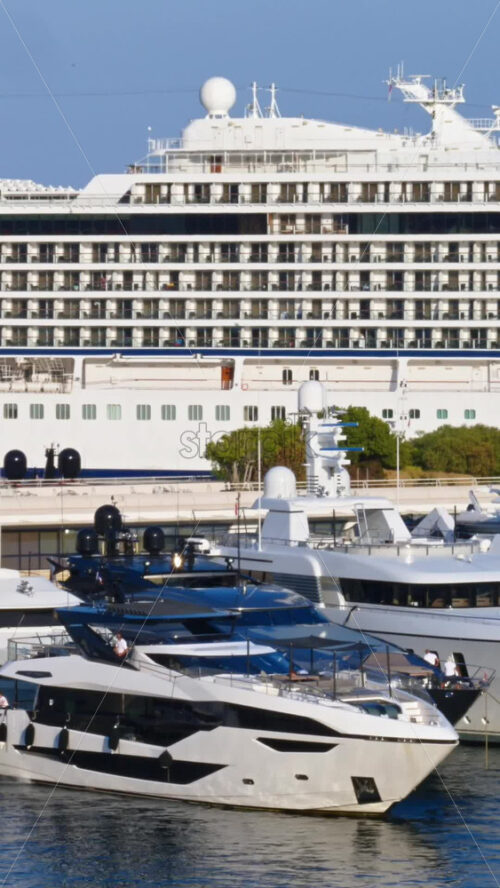 Video - La Condamine, Monaco - September 8, 2024: View of white yacht and multiple boats docked in the Monaco Marina. Vertical