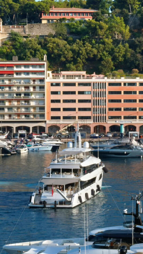 Video - La Condamine, Monaco - September 8, 2024: Boat moving on the sea through the Monaco Marina. Vertical