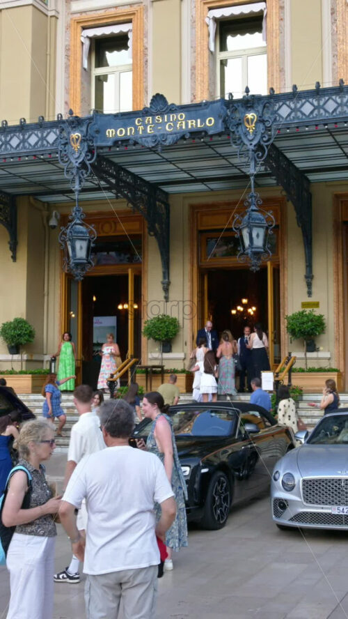 Video - Monte Carlo, Monaco - October 4, 2024: People walking in front of the Monte-Carlo Casino. Vertical