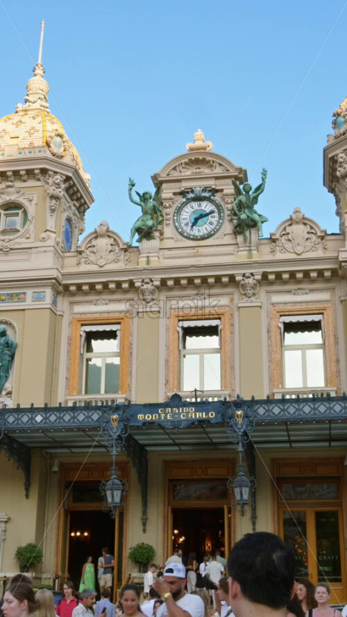 Video - Monte Carlo, Monaco - October 4, 2024: People walking in front of the Monte-Carlo Casino. Vertical