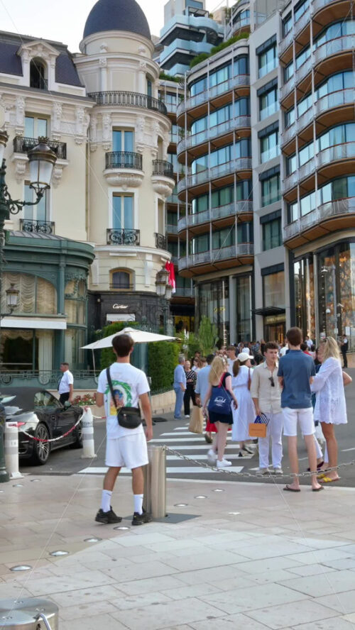 Video - Monte Carlo, Monaco - September 14, 2024: People crossing the street in front of the Monte Carlo Casino. Vertical