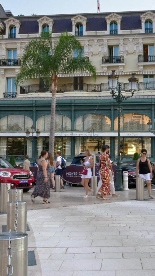 Video - Monte Carlo, Monaco - October 4, 2024: People walking in front of the Monte-Carlo Casino. Vertical