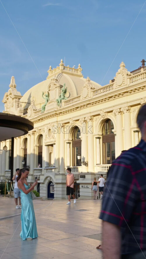 Video - Monaco City, Monaco - October 4, 2024: Luxury cars parked and people moving in front of a Tiffany and Co. store in the city. Vertical