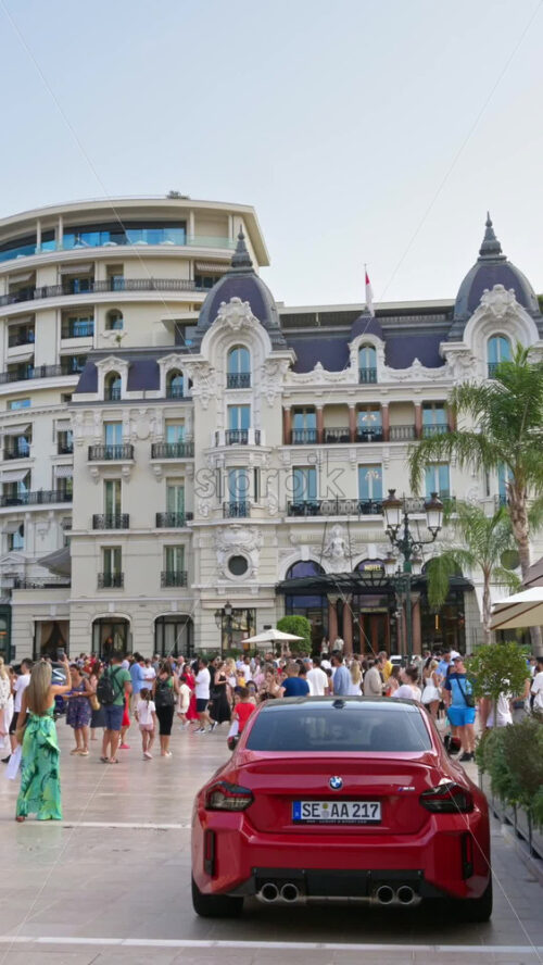 Video - Monte Carlo, Monaco - October 4, 2024: People walking through the courtyard of the Monte-Carlo Casino. Vertical