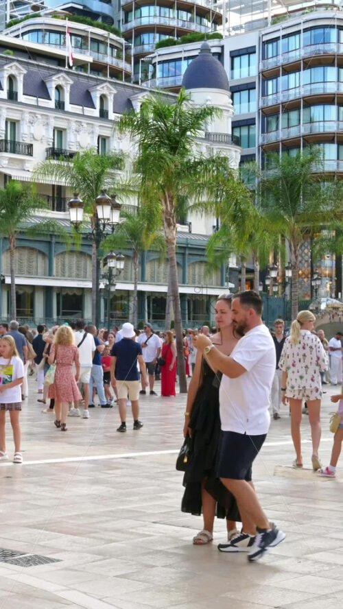 Video - Monte Carlo, Monaco - October 4, 2024: People walking through the courtyard of the Monte-Carlo Casino. Vertical