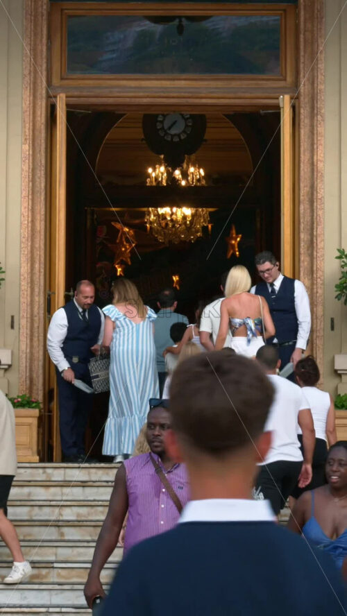 Video - Monte Carlo, Monaco - October 4, 2024: People walking in front of the Monte-Carlo Casino. Vertical