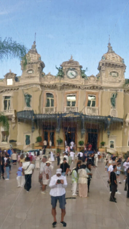 Video - Monte Carlo, Monaco - October 4, 2024: Sky mirror sculpture in front of The Monte Carlo Casino with people walking around it. Vertical