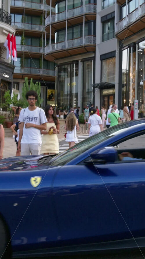 Video - Monaco city, Monaco - September 14, 2024: People and cars moving on the streets of the city. Vertical