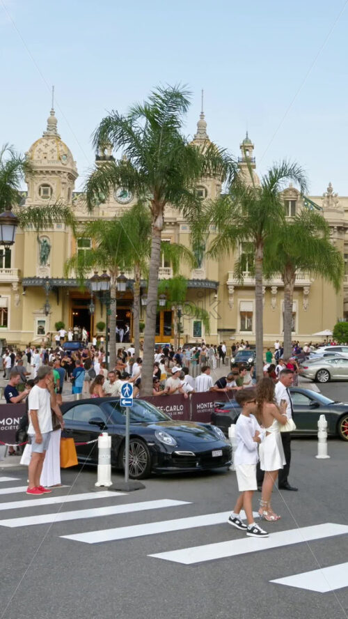 Video - Monte Carlo, Monaco - September 14, 2024: People crossing the street in front of the Monte Carlo Casino. Vertical
