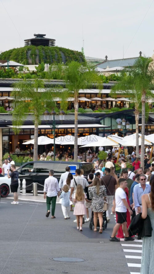 Video - Monaco city, Monaco - September 14, 2024: People and cars moving on the streets of the city. Vertical
