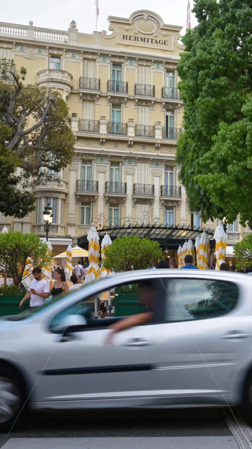 Video - Monte Carlo, Monaco - September 14, 2024: People crossing the street in front of the Monte Carlo Casino. Vertical