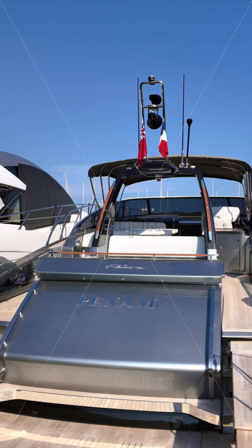 Video - Beaulieu-sur-Mer, France - July 5, 2024: White boats docked in the Port of Beaulieu-sur-Mer in daylight. Vertical