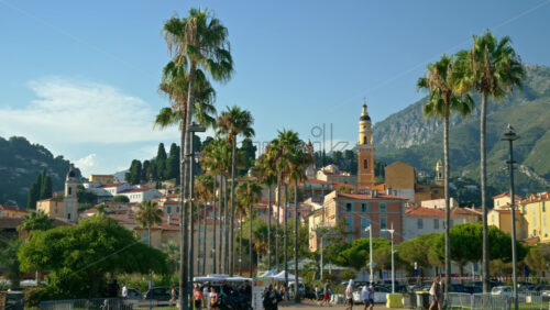 Video - Menton, France - September 4, 2024: Distant view of the St Michel Basilica surrounded by colourful buildings
