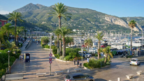 Video - Menton, France - September 4, 2024: People and cars moving on the streets of the city