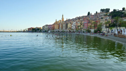Video - View of the sea with the colourful buildings in Menton, France on the background