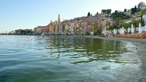 Video - View of the sea with the colourful buildings in Menton, France on the background