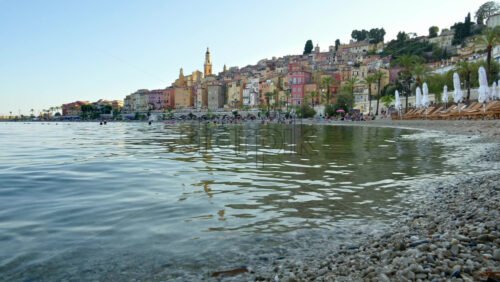 Video - View of the sea with the colourful buildings in Menton, France on the background