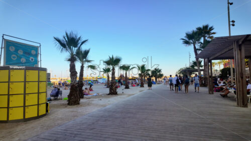 Video - Menton, France - September 4, 2024: People walking on the coastline in the evening