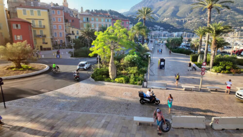 Video - Menton, France - September 4, 2024: People and cars moving on the streets of the city