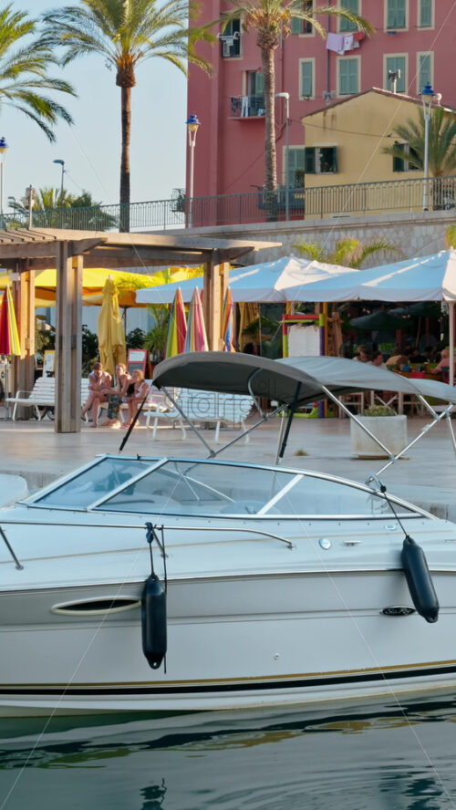Video - Menton, France - September 4, 2024: View of boats docked in the Port de Menton in the French Riviera. Vertical