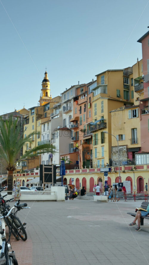 Video - Menton, France - September 4, 2024: People and cars moving on the coastline. Vertical