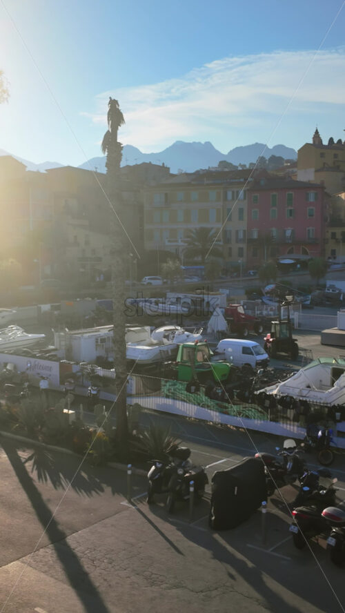 Video - View of boats docked in the Port de Menton in the French Riviera with the colourful buildings in the background. Vertical