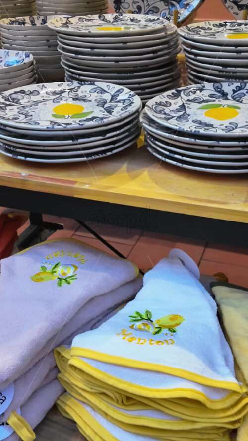 Video - Close up of lemon decorated kitchenware at a store in Menton, France. Vertical