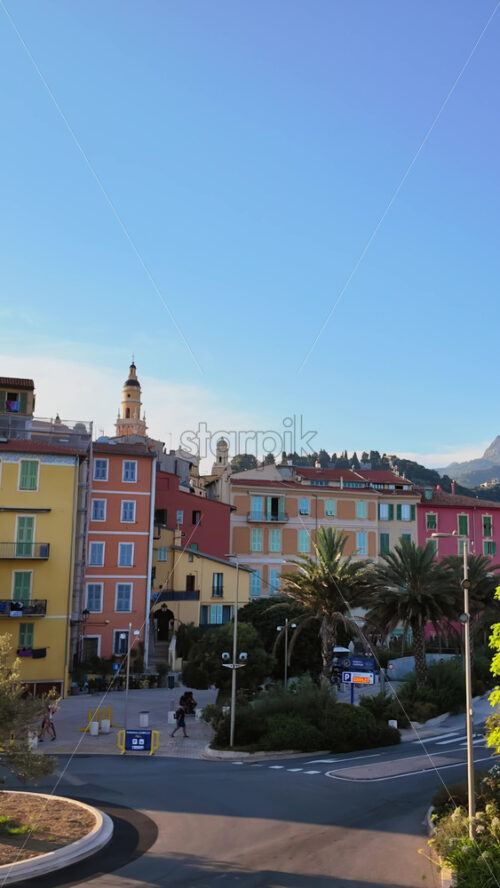 Video - Menton, France - September 4, 2024: People and cars moving on the streets of the city. Vertical